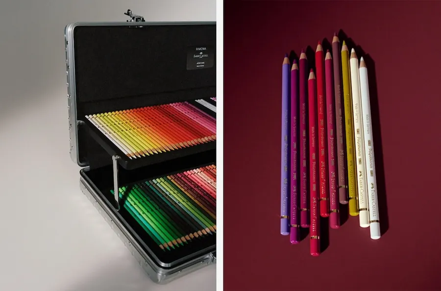 Geöffneter Artist Case von RIMOWA × Faber-Castell mit Einsatz voller Farbstifte, daneben ein Bündel Faber-Castell-Stifte